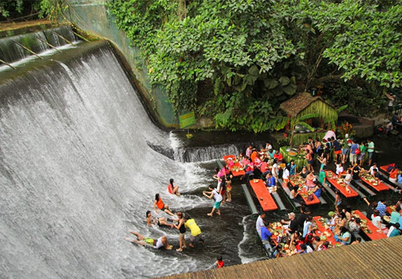 You can dine at the bottom of a waterfall in the Villa Escudero Resort in  Quezon - Y101fm
